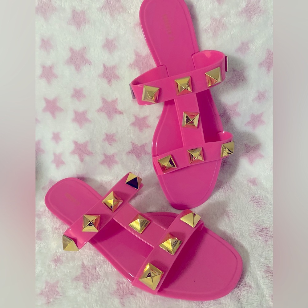 Hot pink sandals with gold pendants